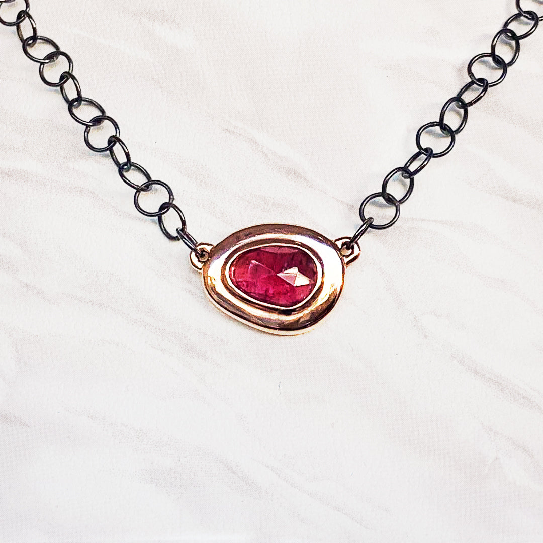 This gorgeous pink tourmaline gem is set in a hand carved rose gold setting to feature its rubellite color in the most brilliant way.