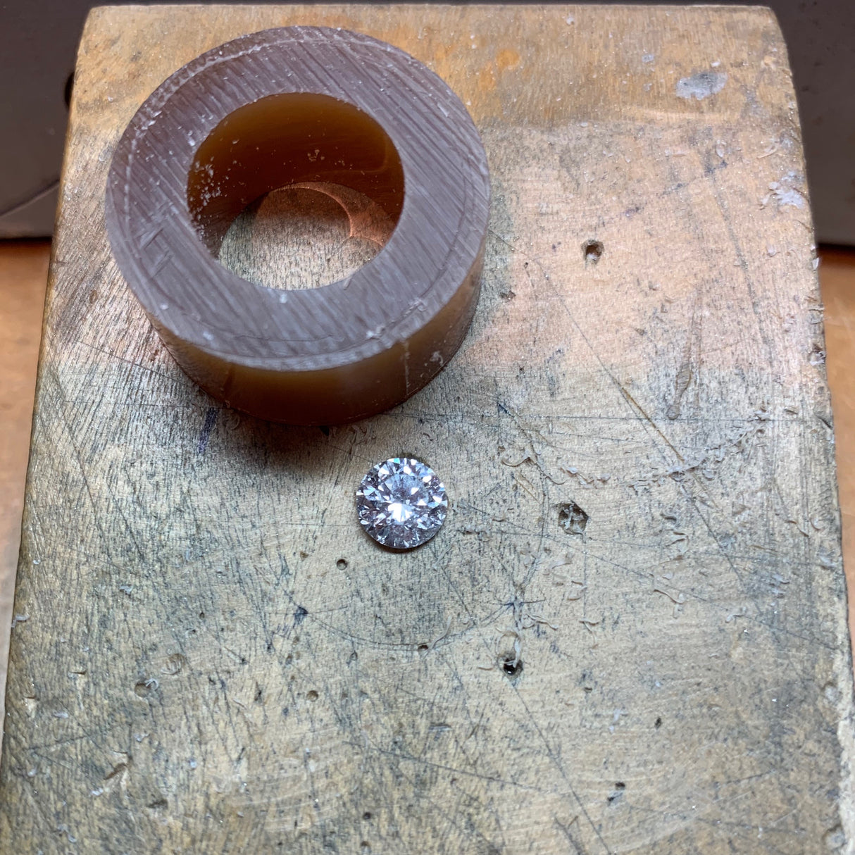 Jeffrey Levin hand carves the setting in wax.