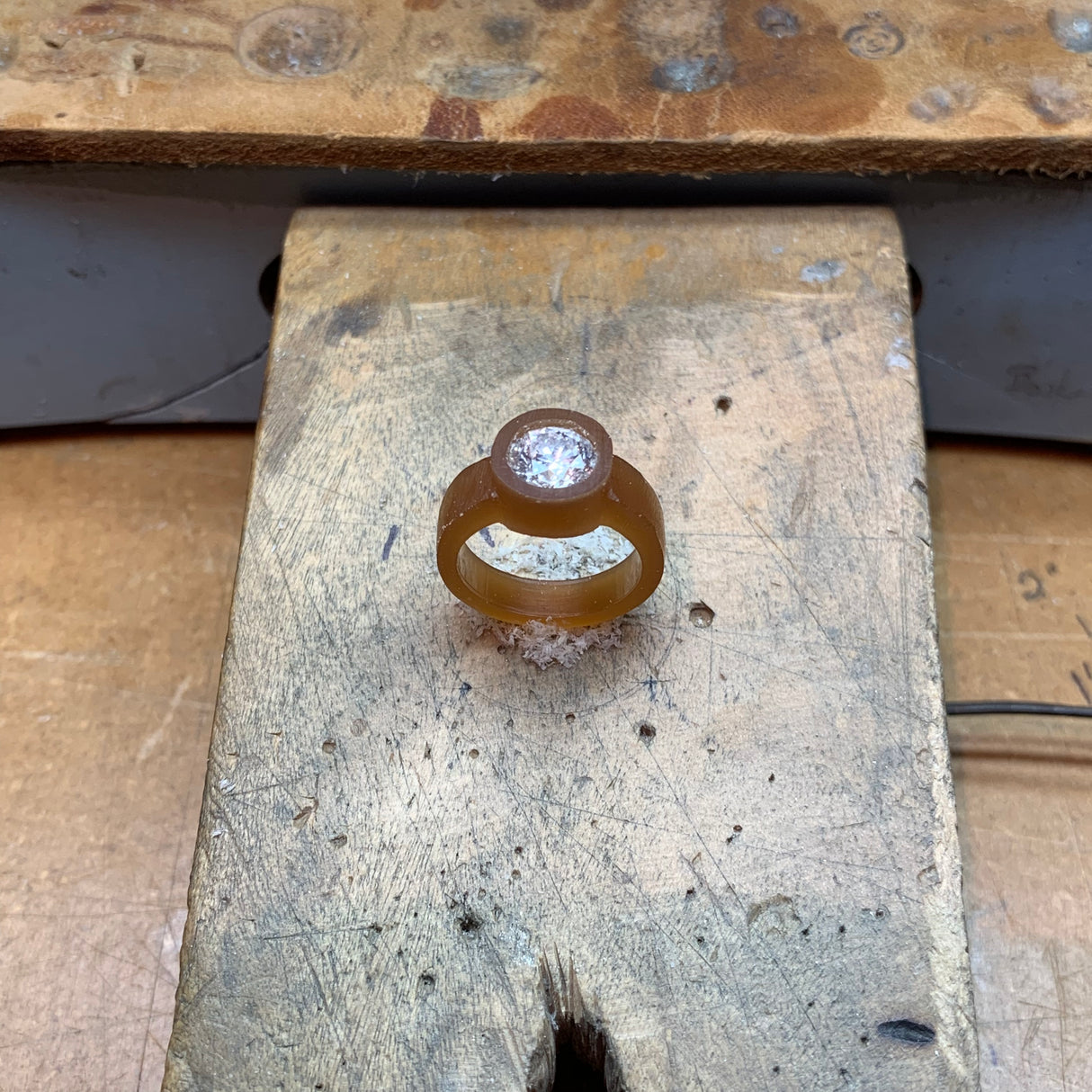 The near final step in the process. Jeffrey Levin hand carves the setting in wax.