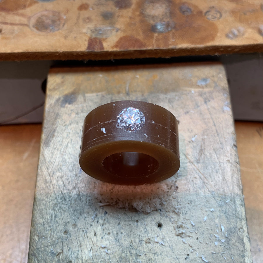 Custom Engagement Ring Process. Carving wax to feature the diamond. We source diamonds and gems and we're also happy to work with an heirloom stone you have in your family.