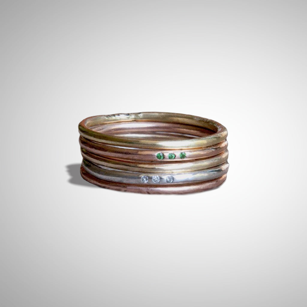 Jeffrey Levin's super skinny rings pair well with engagement rings and wedding bands. 