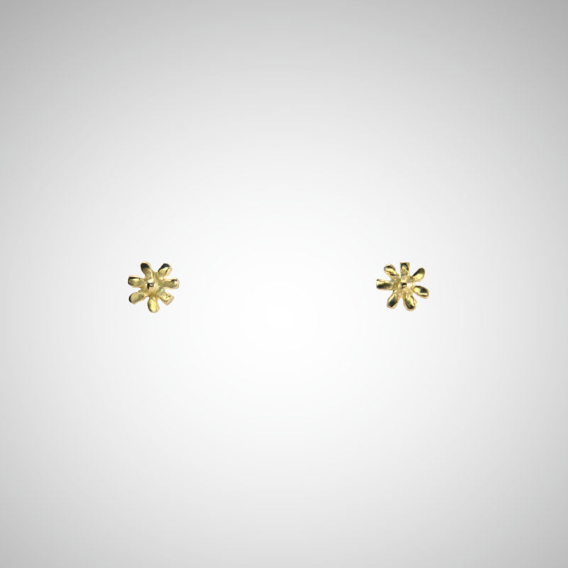 A delicate flower but mighty in spirit. These are his most tiny, carved by hand in wax before being cast in precious metals. Perfect for layering as multiples. Shown in yellow gold.