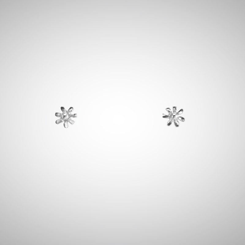 A delicate flower but mighty in spirit. These are his most tiny, carved by hand in wax before being cast in precious metals. Perfect for layering as multiples. Sterling Silver