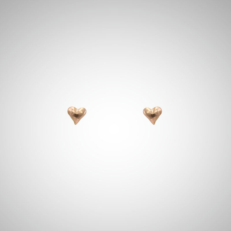 Jeffrey has been carving hearts from the beginning. These are his most tiny, carved by hand in wax before being cast in precious metals. Perfect for layering as multiples. Shown in rose gold.