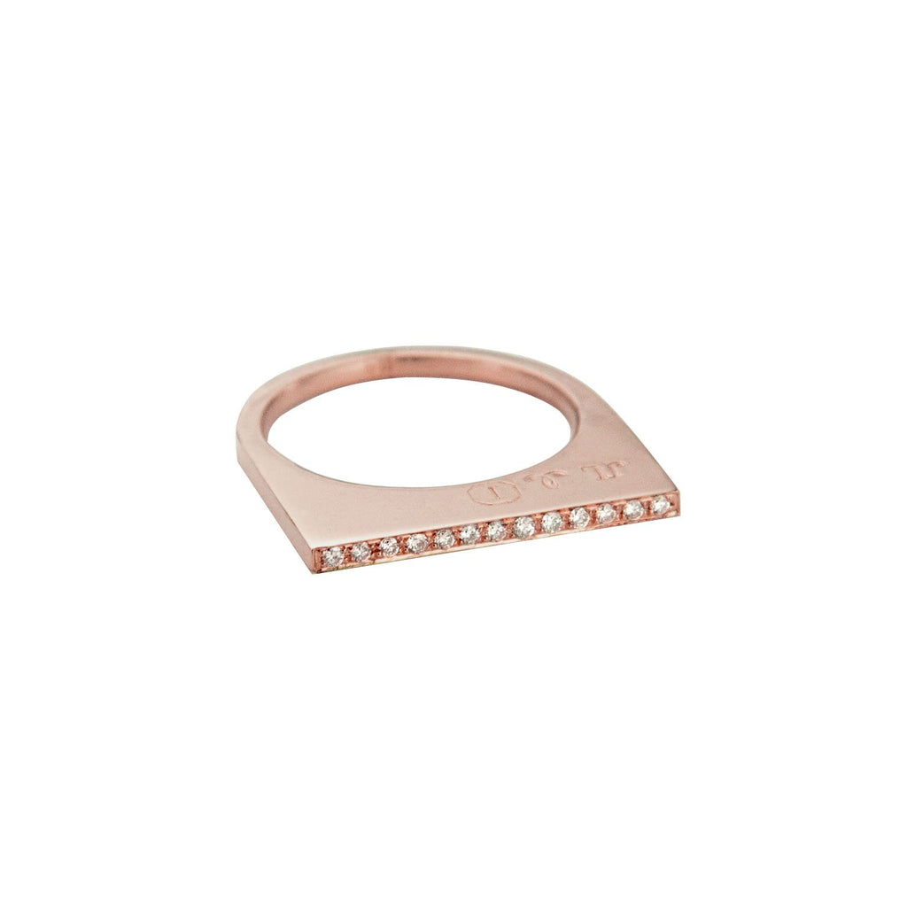 Add dramatic height and sparkle to your stacking rings with Jeffrey Levin's super flat skinnys encrusted in diamonds or colorful gems. Inspired by beautiful bon bon desert plating, Jeffrey Levin designed a unique proportion and stunning surface in 14k rose gold with pave set diamonds.