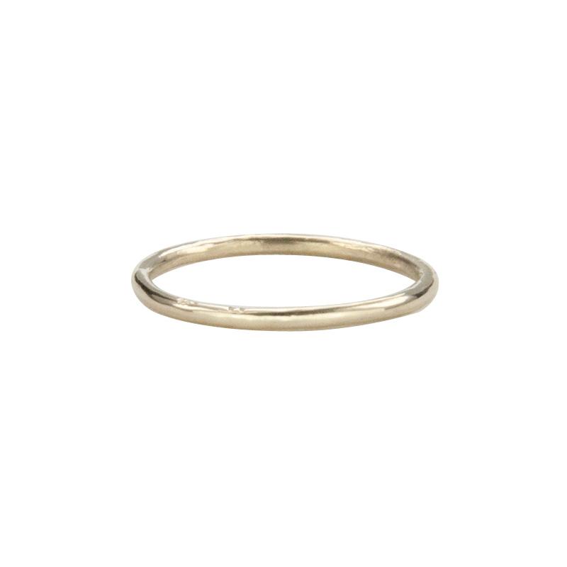 Jeffrey Levin's 14K yellow gold super skinny rings pair well with engagement rings and wedding bands.