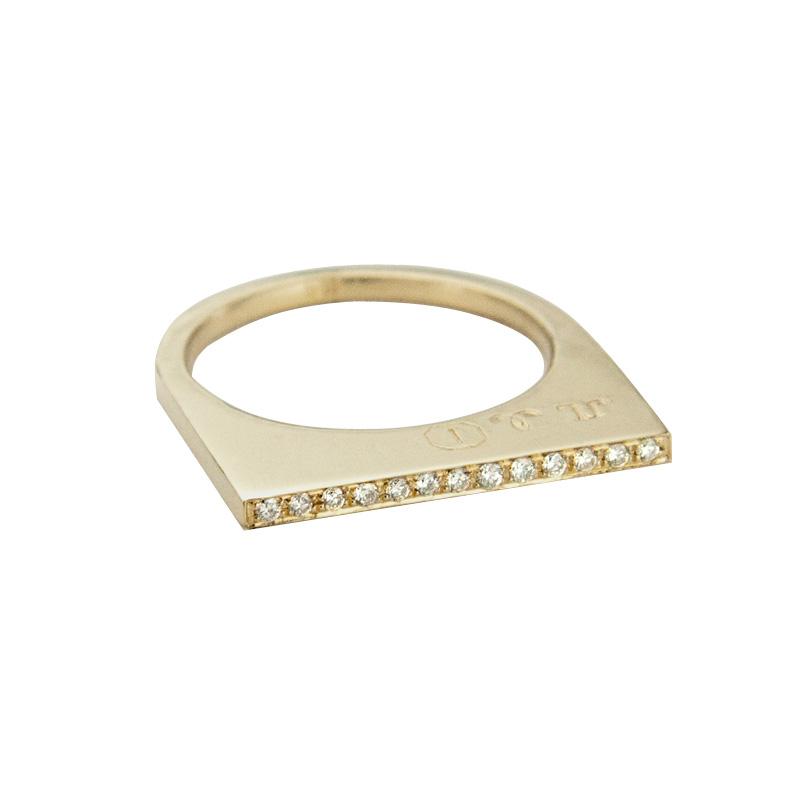 Add dramatic height and sparkle to your stacking rings with Jeffrey Levin's super flat skinnys in 14K yellow gold encrusted in diamonds or colorful gems. Inspired by beautiful bon bon desert plating, Jeffrey designed a unique proportion and stunning surface in mixed metals with pave set diamonds.
