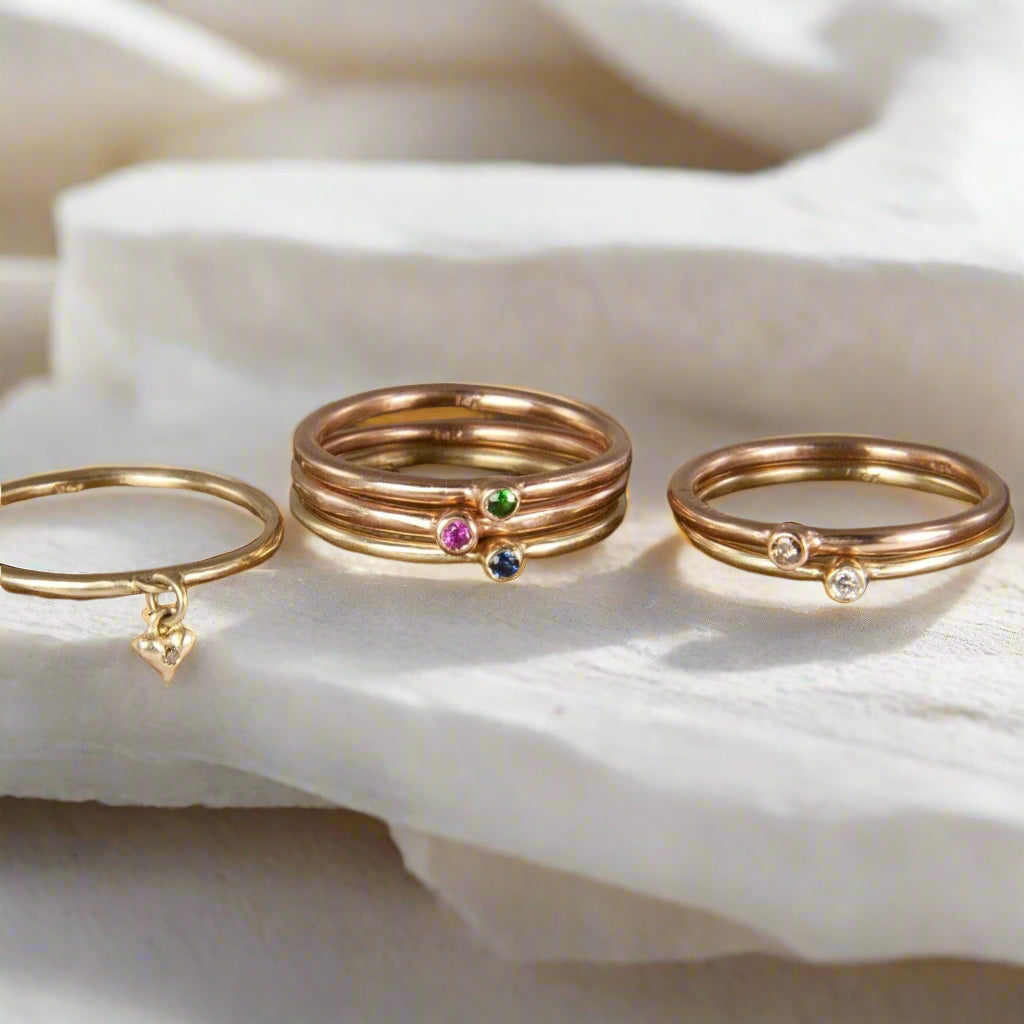 These super skinny stacking rings by Jeffrey Levin are adorned with single stones in your mix of precious metals and gems. They're are delicate, simple and personal. Wear alone or stack with your blend of plain, 3-stone burnished or other single-stone bezel set skinny rings in mixed metals and with diamonds or colorful gems.