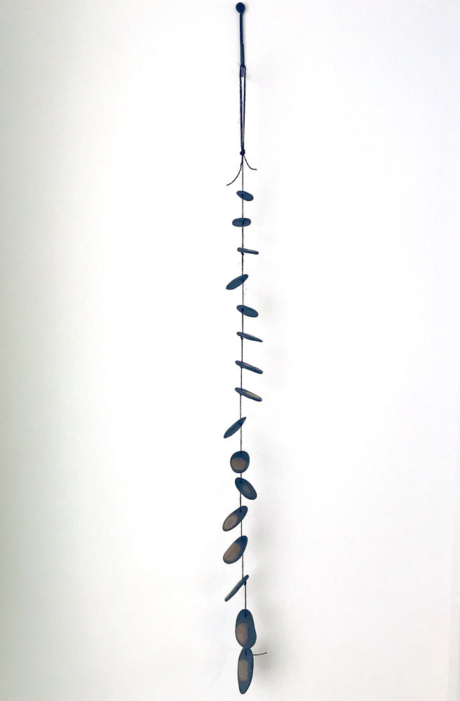 The Droplets is a hand built ceramic wall hanging with references to water, pebbles and other natural materials. The freeform shapes have a visceral quality, inspired by observations of landscape, the natural world, textiles, and metallic elements.