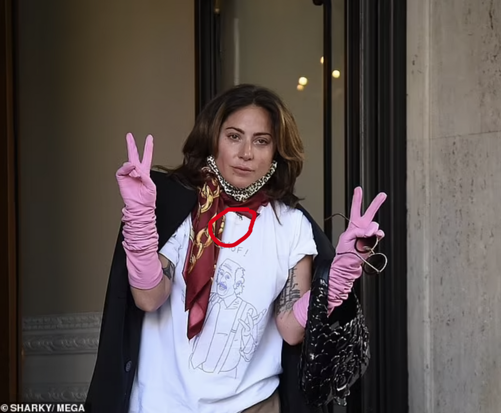 Lady Gaga waves goodbye to Rome wearing Jeffrey Levin Dog Tag with Tiny Heart necklace, after wrapping the House of Gucci movie
