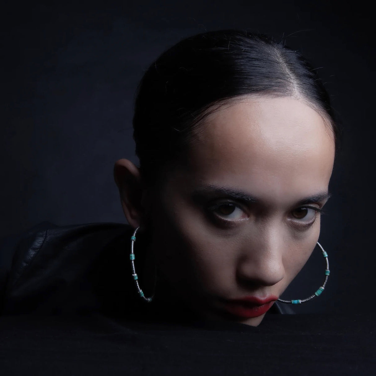 Big Hoops! A galaxy of stone spheres suspended from etched silver orbit your ears. Lightweight but heavy statements in Baltic Amber, Turquoise or Smoky Quartz.