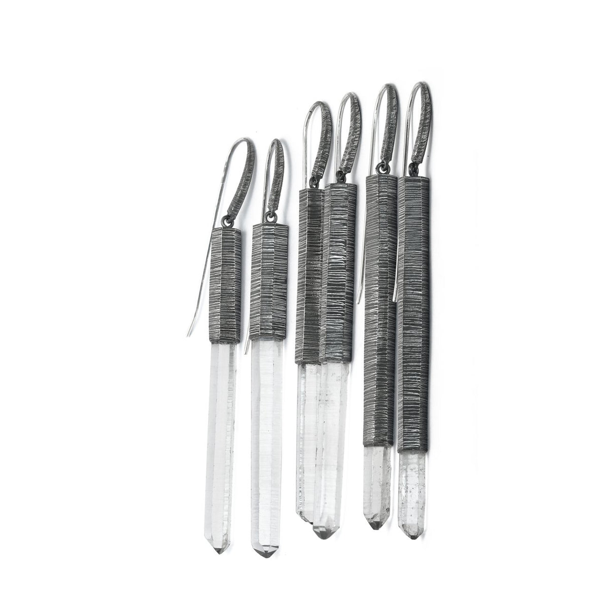 Mariella's Wand earrings are designed using a crystal point embraced in etched silver