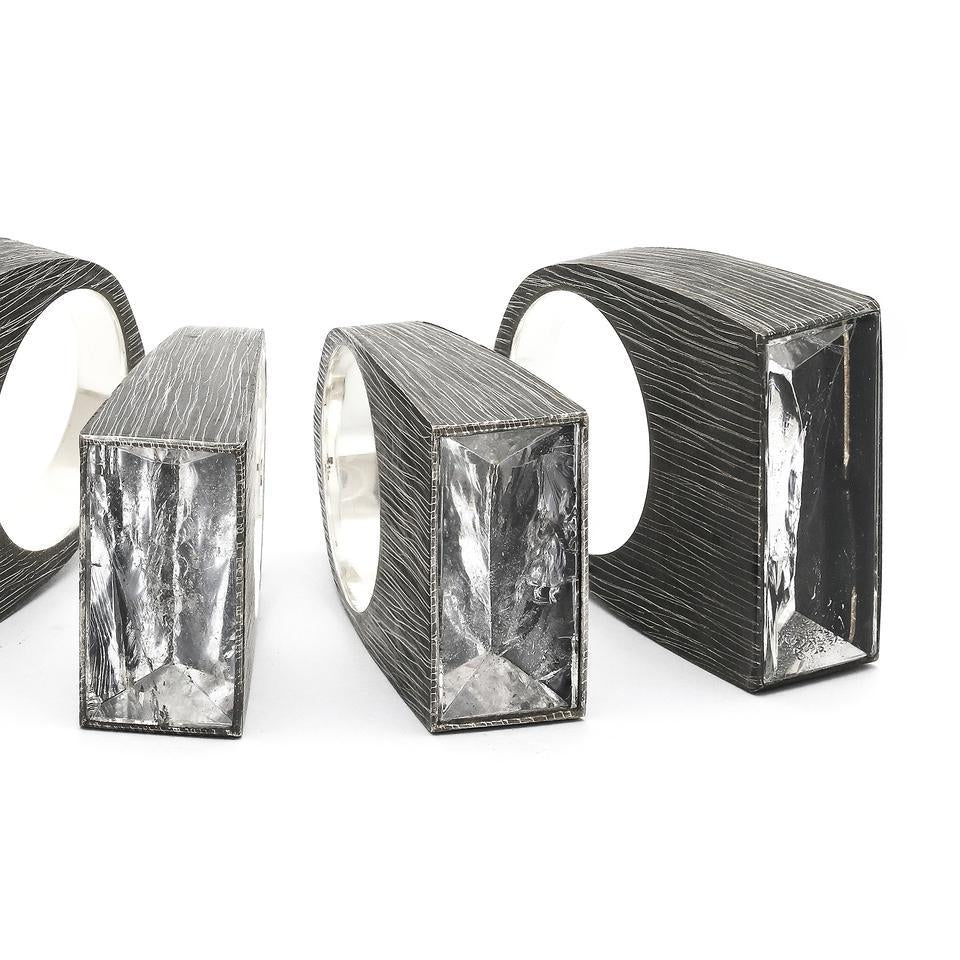 The high contrast and strong profile of these light box rings both draws in and reflects the light. Adorn your ring stack with this mood lifting accoutrement! Side view of group.