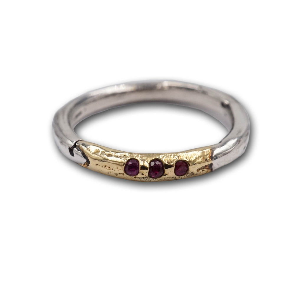 Mixed metals of 14K gold and sterling silver Mel collection stacking band with cast in place rubies add covetable drama to your ring stack! 