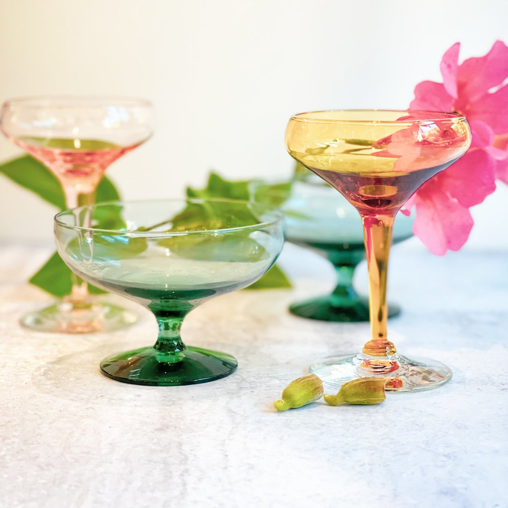 Modernist designer Russel Wright is most well known for his ceramics. His glassware is something special, too. We love the sensual lines and jewel and pale tones of these stunning champagne coupes