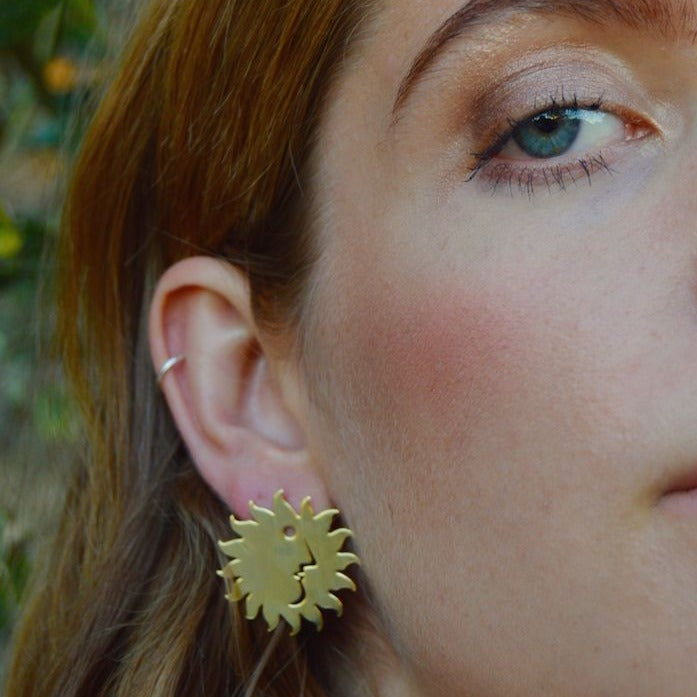 Yellow Jewellery's stylish, illustrated cut-out sun face design. The Sol of the Sun Gangs post earrings bring the energy of the only star in our solar system!