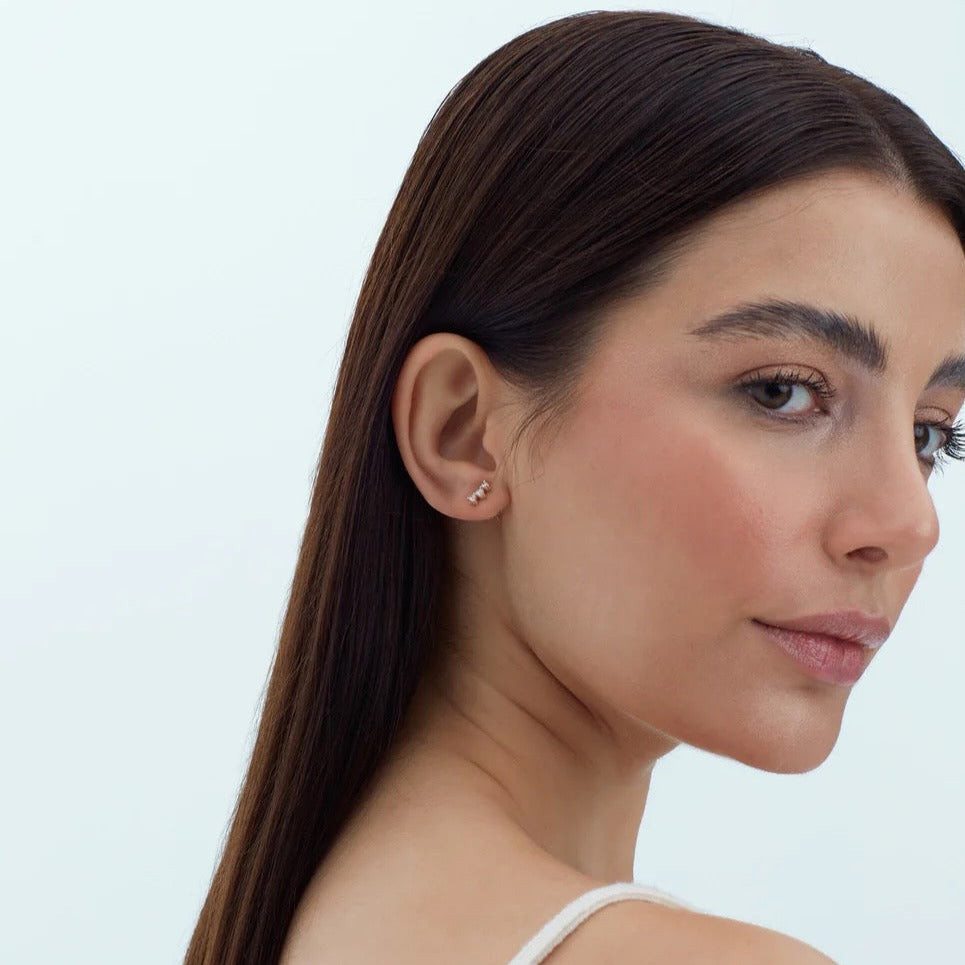 Elegant 14K gold studs feature 3 diamonds on each earring. Wear them as everyday adornment. Stunning recycled and ethically sourced diamonds are paired with recycled 14K yellow gold, rose gold or white gold.