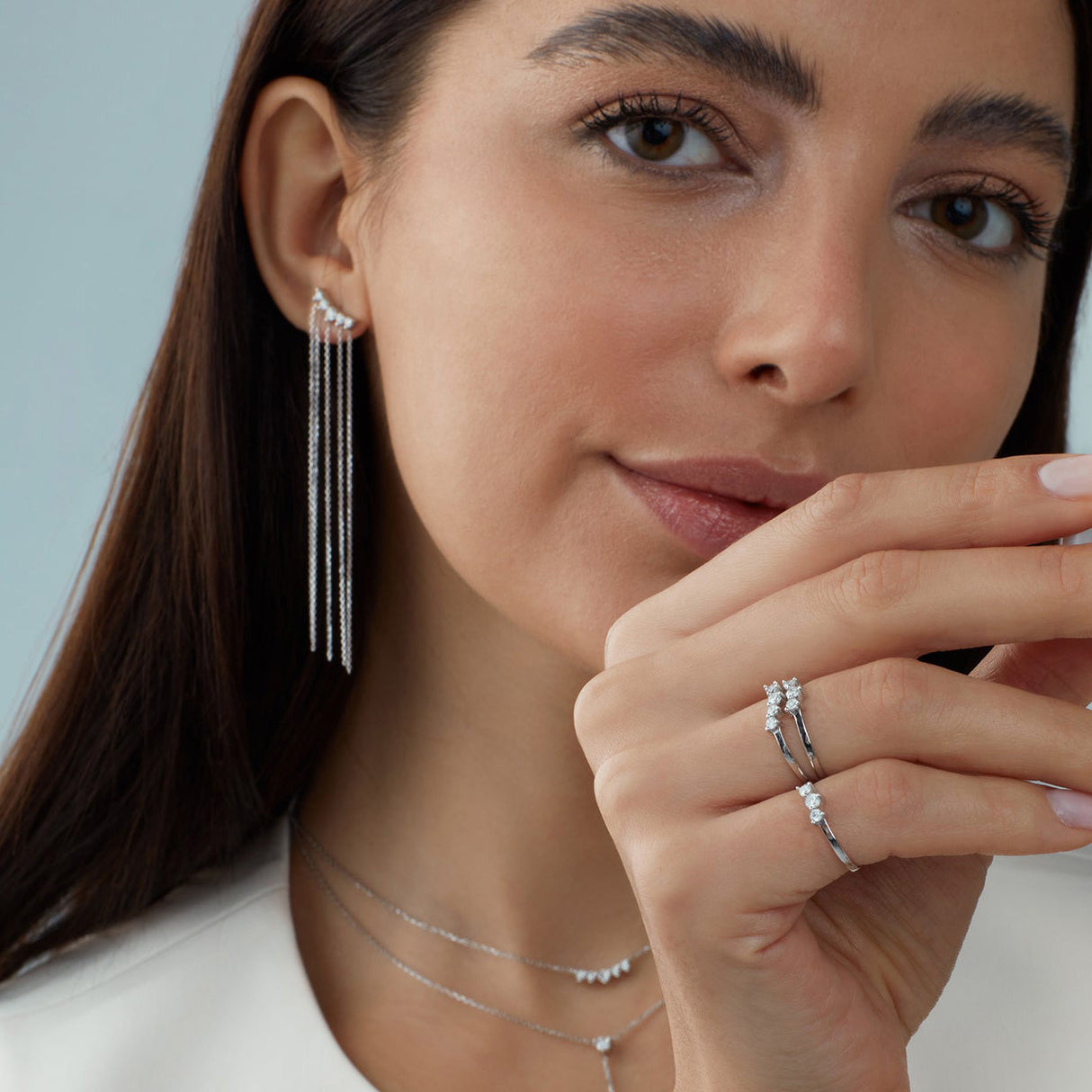 Delicate 3 diamond and 14K Gold Stacking Rings on Model