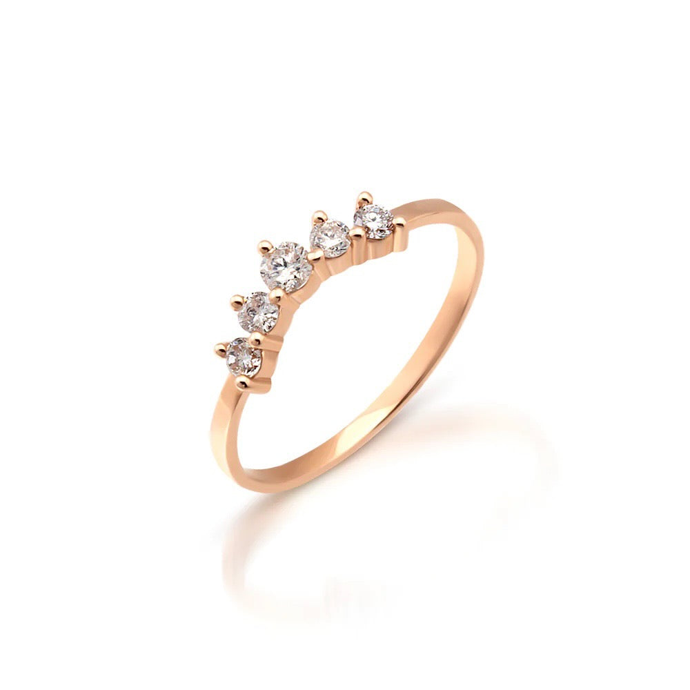 Light up your ring party with these delicate 5 diamond and 14K gold every day stacking rings. Rose gold pictured. Side view.