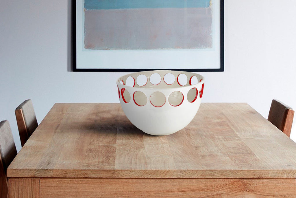 Our discovery of small batch wheel thrown pottery highlights artists with a talent for elegant, minimalist and experimentalserving ware and home decor. Many items are one of a kind or limited edition. Shown Julems Pierced Bowl