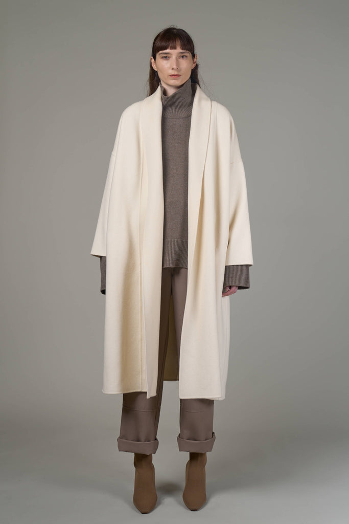 The Jadis coat by Mute by JL features a blend of soft Merino wool and silk, resulting in a luxurious fabric feel. 
