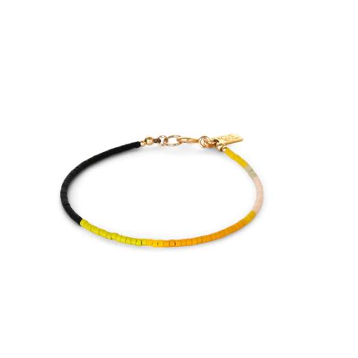 A Yellow Sun bracelet is composed of fine glass beads in yellow, pink and black and is a great layering piece. 
