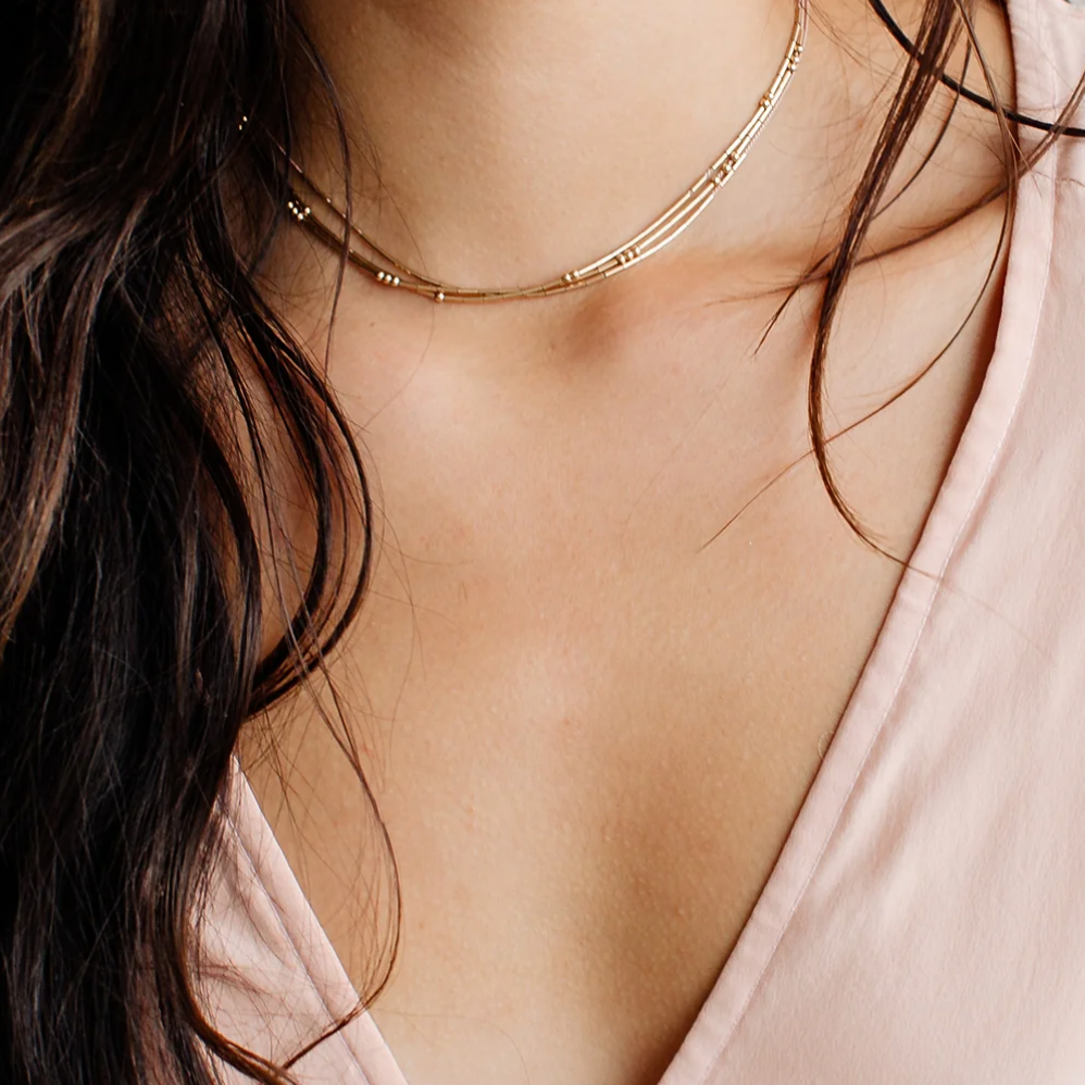 Designed as a choker, the Pictor necklace will rest at the base of the neck for most customers.