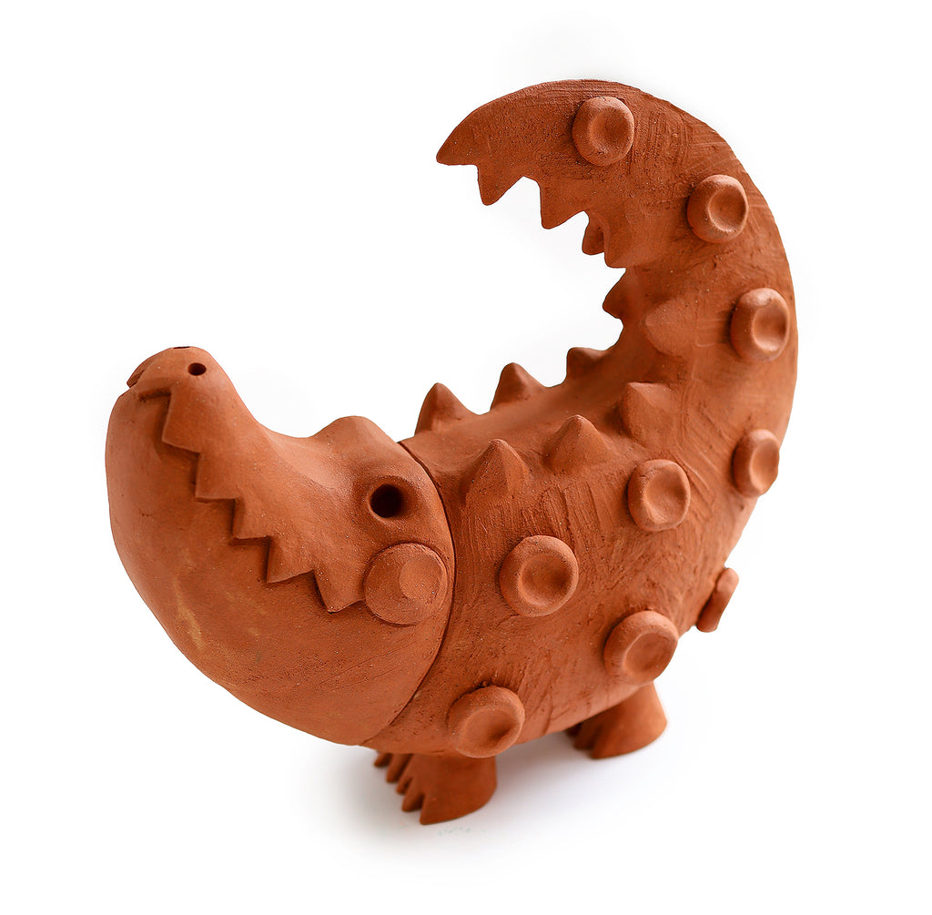 We love the naked clay and Mayan influence in Austyn Taylor's newest fun folk-pop character, Virgil. Find amusement in the textural details, claws and smile and bring him home as part of your family! 