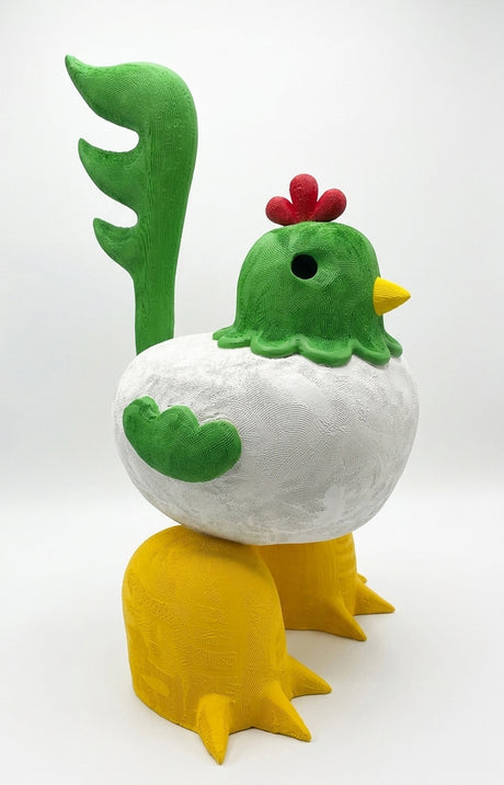 Ceramic figure of a rooster with green head, white body, and yellow legs on a white background