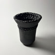Dark Holding Vase in black clay  with intricate details inspired by the resilient plants of the desert, their forms and textures