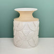 This gorgeous wheel thrown vase is a technical feat with hand carved relief designs.