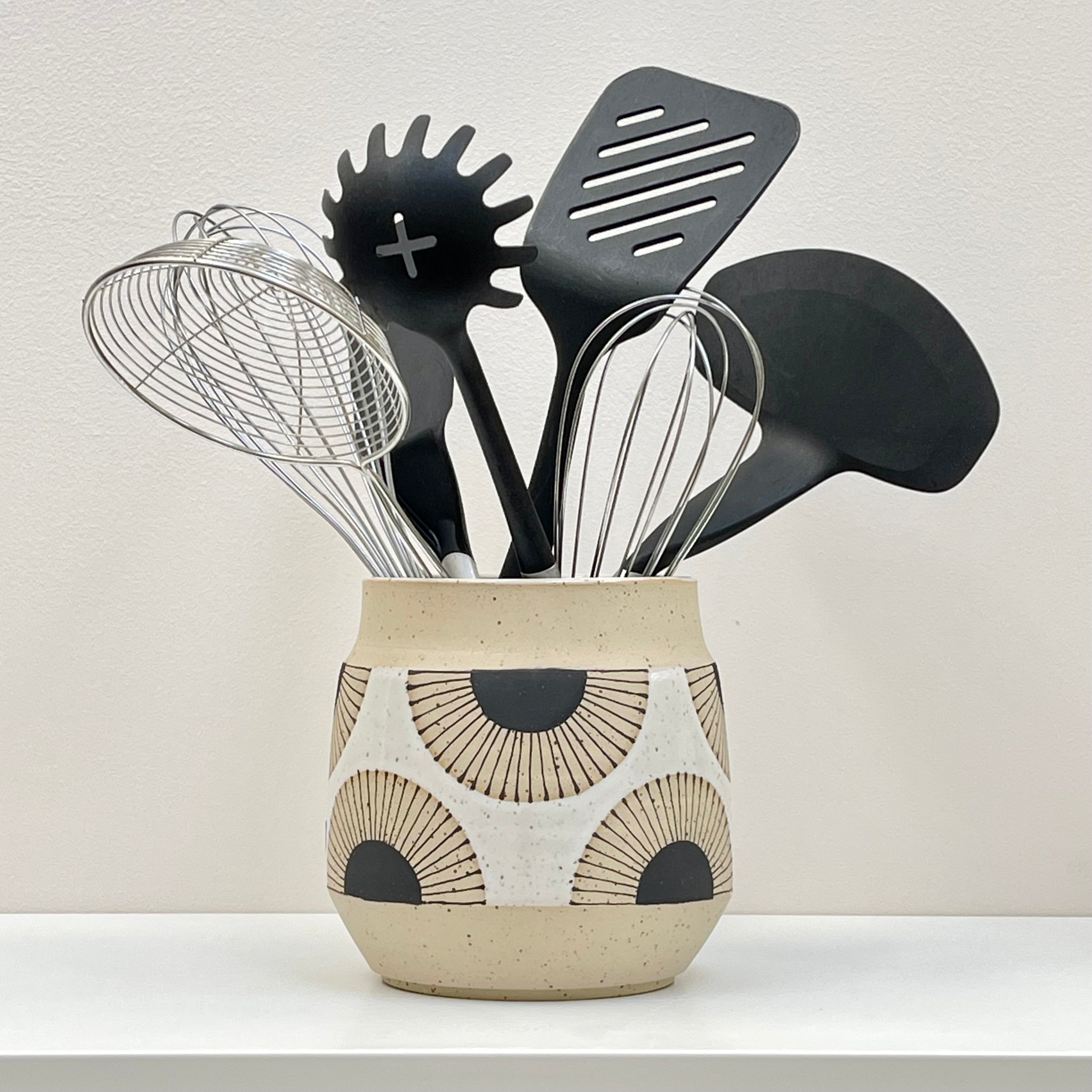 https://poetandthebench.com/cdn/shop/files/Ceramics_UtensilsHolder_BlackSun_withutensils.jpg?v=1694832258