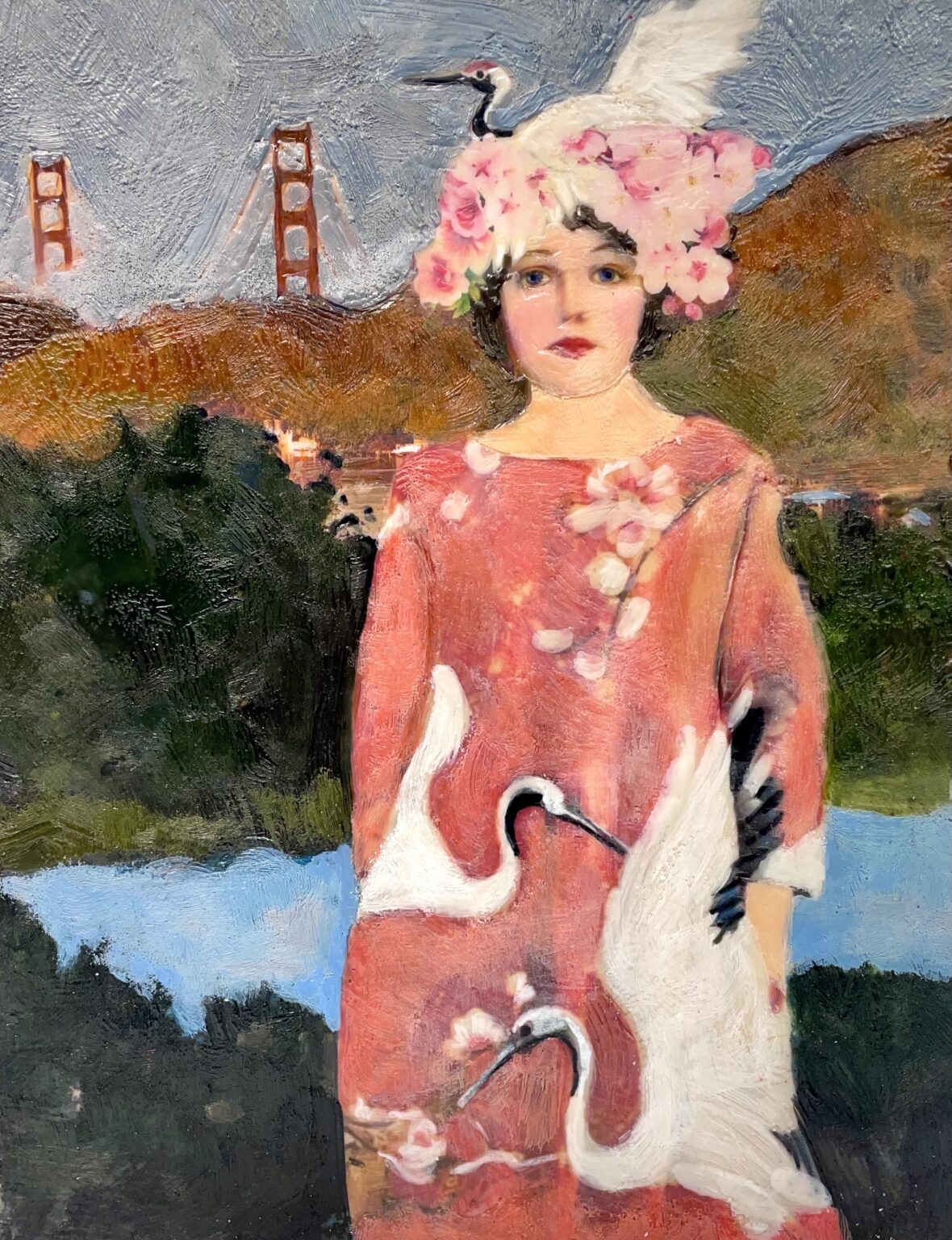 Woman in a red dress with painted cranes and floral headpiece against a landscape with the Golden Gate Bridge.