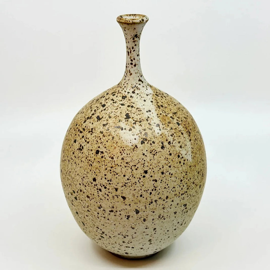 No 37 vase by Dana Chieco Ceramics is a deep speckled clay with deep amber areas that give it a sublime contrast and glazed in matte white. Try it with a single weed stem or dried flower. 