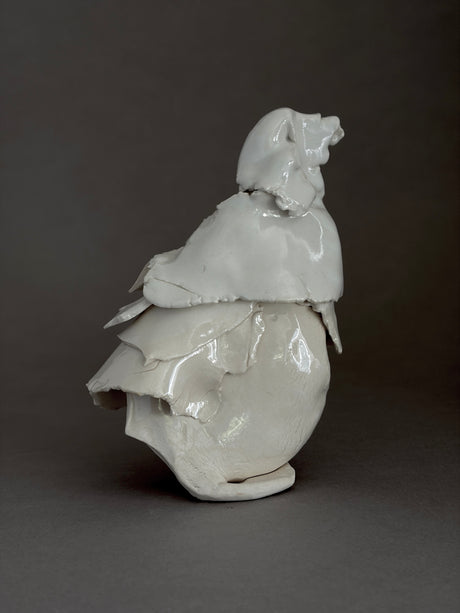 White modern ceramic sculpture of a bird figure in Porcelain in brutalist style by photographer David Duncan Livingston