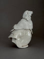 White modern ceramic sculpture of a bird figure in Porcelain in brutalist style by photographer David Duncan Livingston