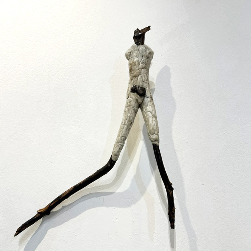 This new series follows the shapes of the fallen wood Denise has collected. Vol 11 is a standing male figure, mounted on steel to hang on the wall. From the artist: "I am captivated by the human figure and the way a gesture can speak to us. A simple truth through simple forms, this is what inspires me to create sculptures."