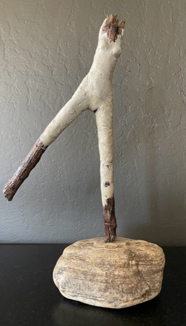 This new series follows the shapes of the fallen wood Denise has collected. Vol 4 is a graceful standing female figure with elongated legs. Mounted on stone.