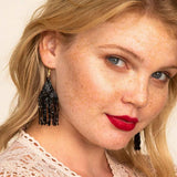 Lexie Woven and Beaded Earrings in a Solid Color Way of Shimmering Black for a statement of dramatic color, shown on model