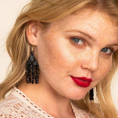 Lexie Woven and Beaded Earrings in a Solid Color Way of Shimmering Black for a statement of dramatic color, shown on model