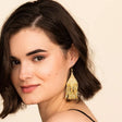 Lexie Woven and Beaded Earrings in a Solid Color Way of Shimmering Gold shown on model