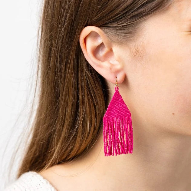 Lexie Woven and Beaded Earrings in a Solid Color Way of Hot Pink for a fresh pop of color, shown on model