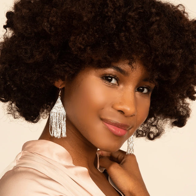 Lexie Woven and Beaded Earrings in a Solid Color Way of Shimmering Silver shown on model