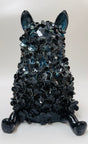 A glossy midnight blue ceramic figurine of a French Bulldog decorated with flowers