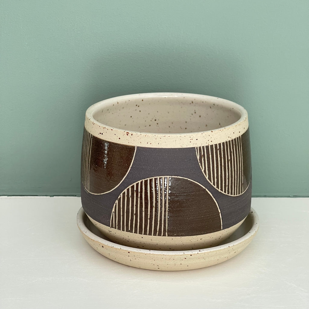 Wheel thrown planter by Julems Ceramics and hand decorated with a half scallop repeating design. 