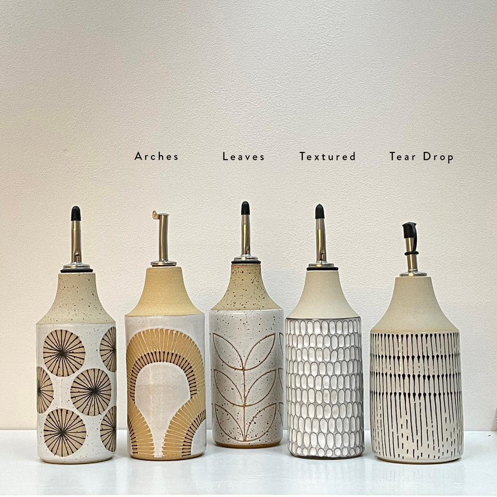 Your olive oil and vinegar pour just got an upgrade with these super cool oil bottles by Judith Lemmens, designer behind the Julems line of wheel thrown ceramics. With Radial lines, arches, leaves, texture and tear drops