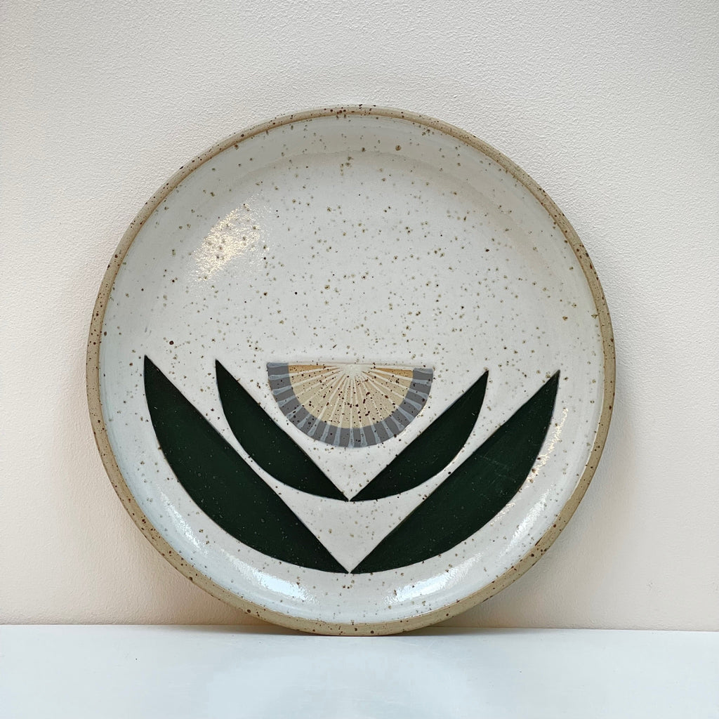 Scandinavian influenced folk art designs make this wall hanging plate a beautiful edition to your gallery wall! We love the grey flower aesthetic by Julems Ceramics