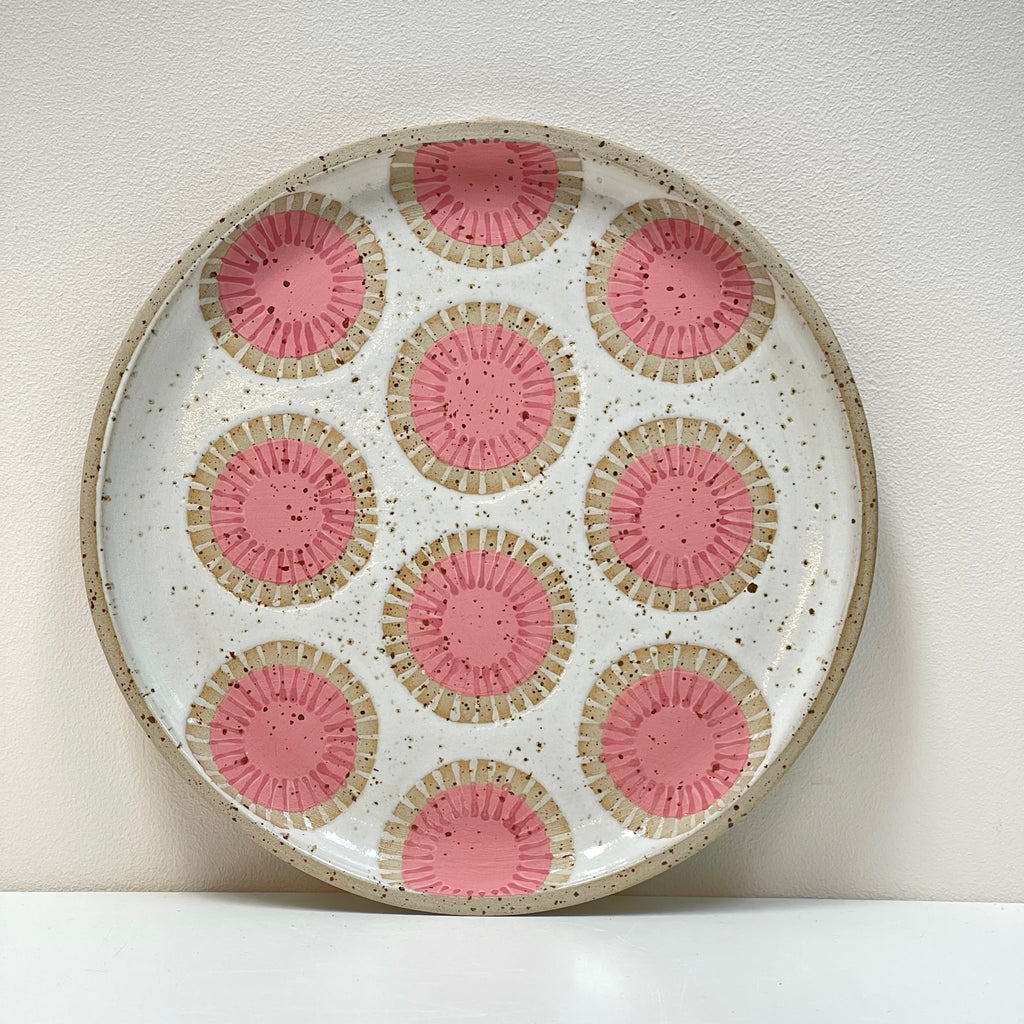 Scandinavian influenced folk art designs make this wall hanging plate a beautiful edition to your gallery wall! We love the geometric pink circles aesthetic by Julems Ceramics