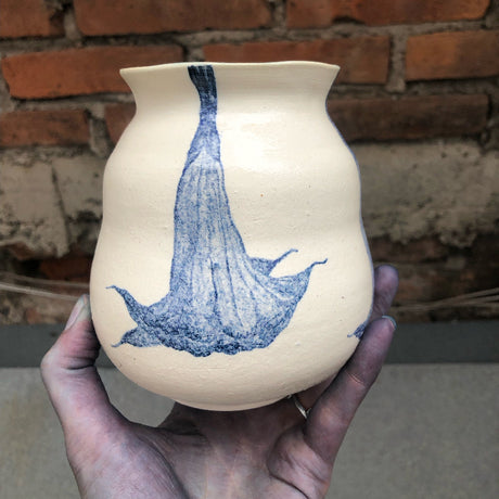 Ceramic vase with blue watercolor paintings of trumpet flowers