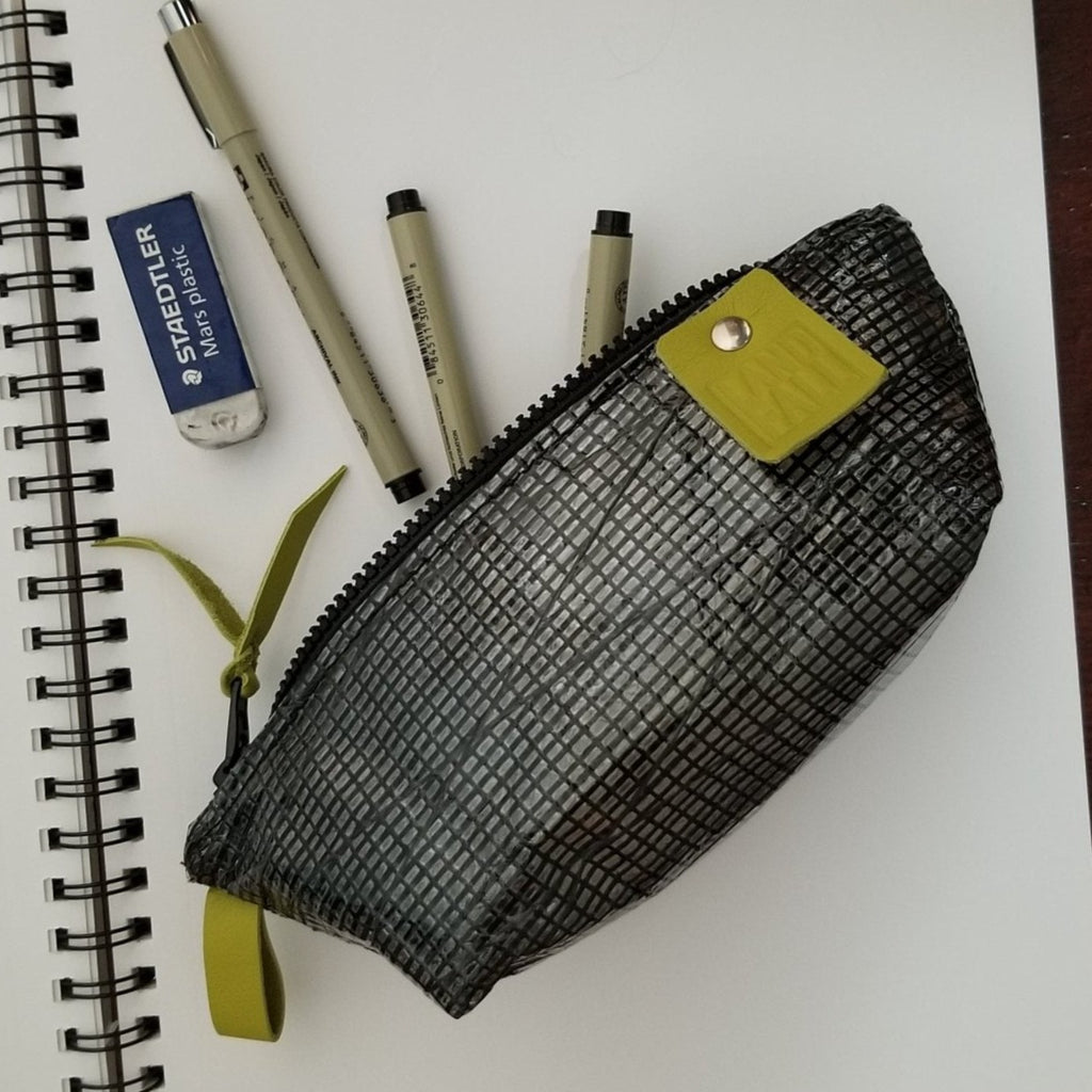 The Pencil Case in black sail cloth is a packable zip pouch for pens, pencils, art supplies, cables or personal items. 